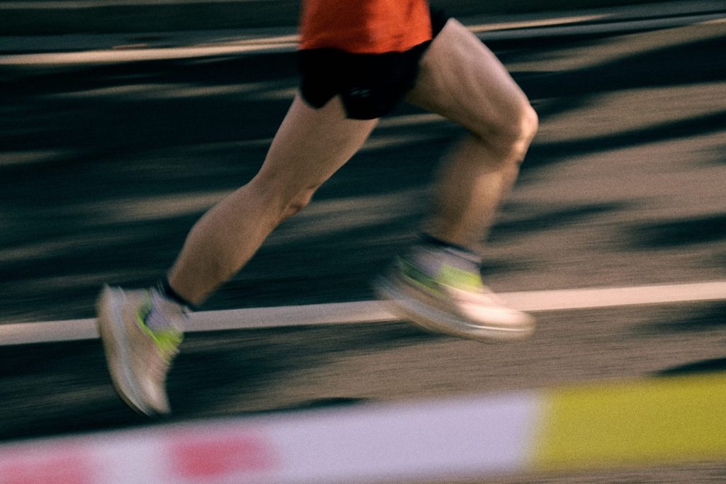Runner's legs in motion on a track